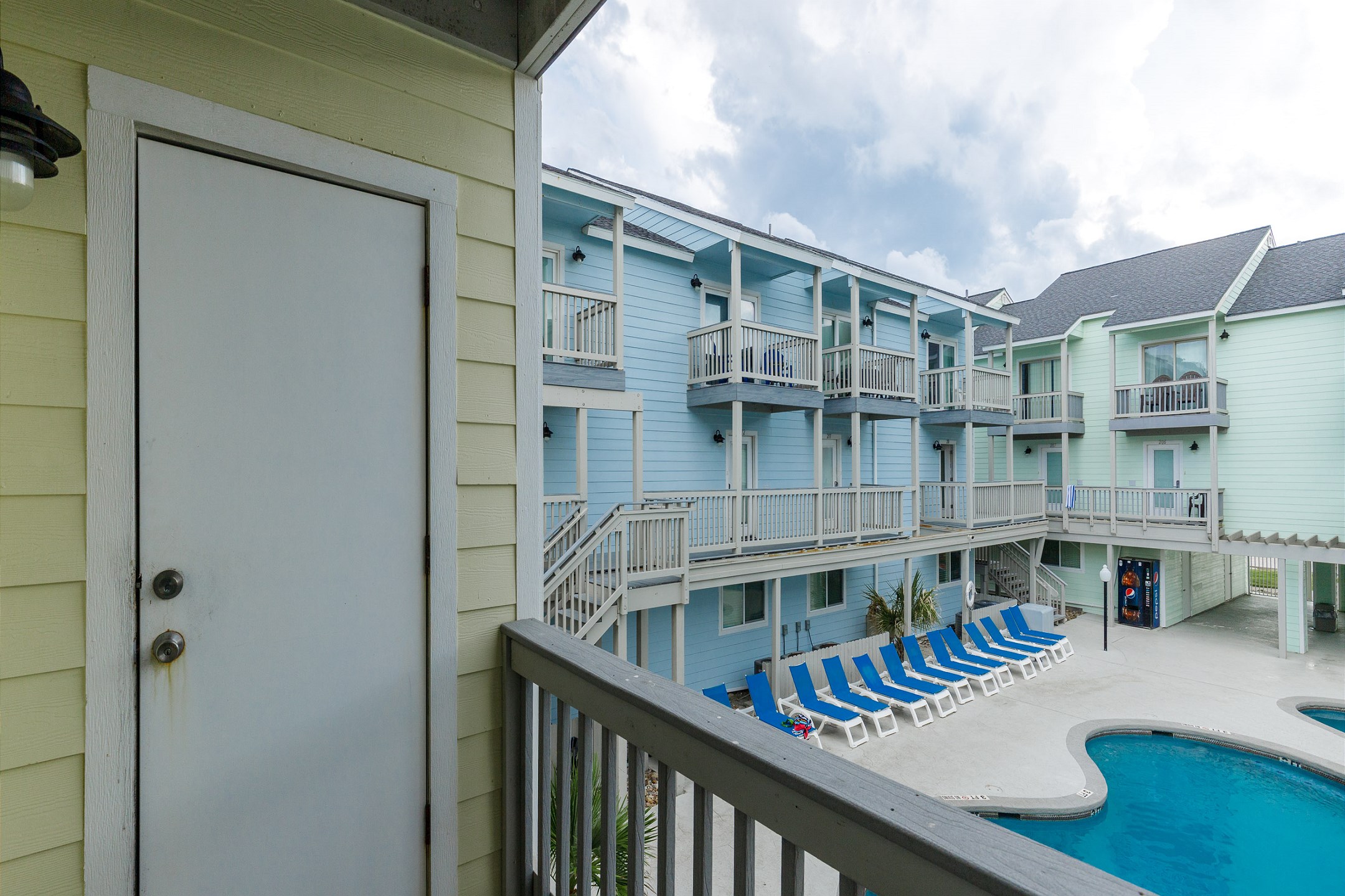 Living area balcony with a great view of the pool