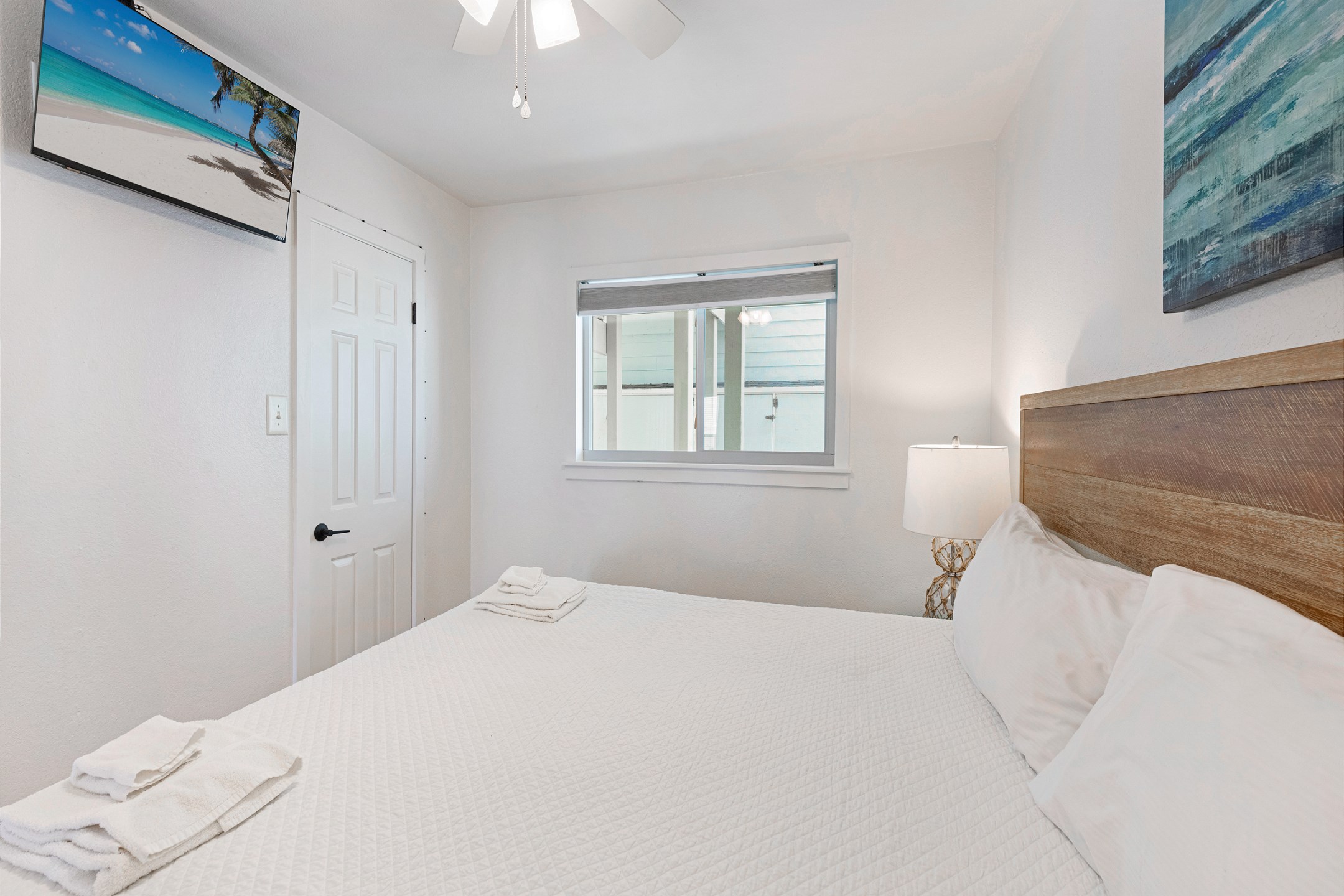 Master bedroom with king size bed and flat screen TV