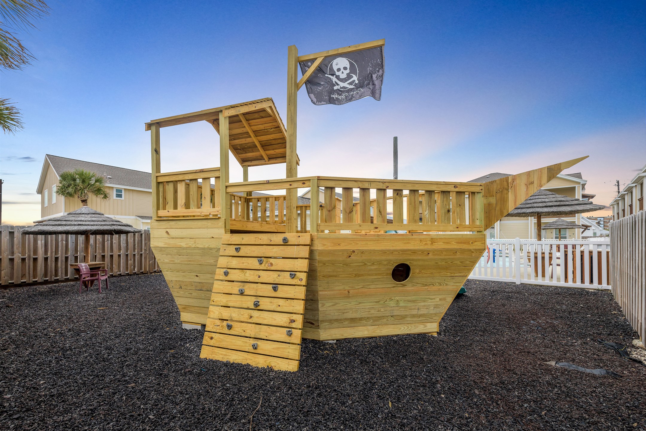 The ultimate family-friendly feature: a playground with swings, slides, and a pirate ship design—perfect for keeping the kids entertained!