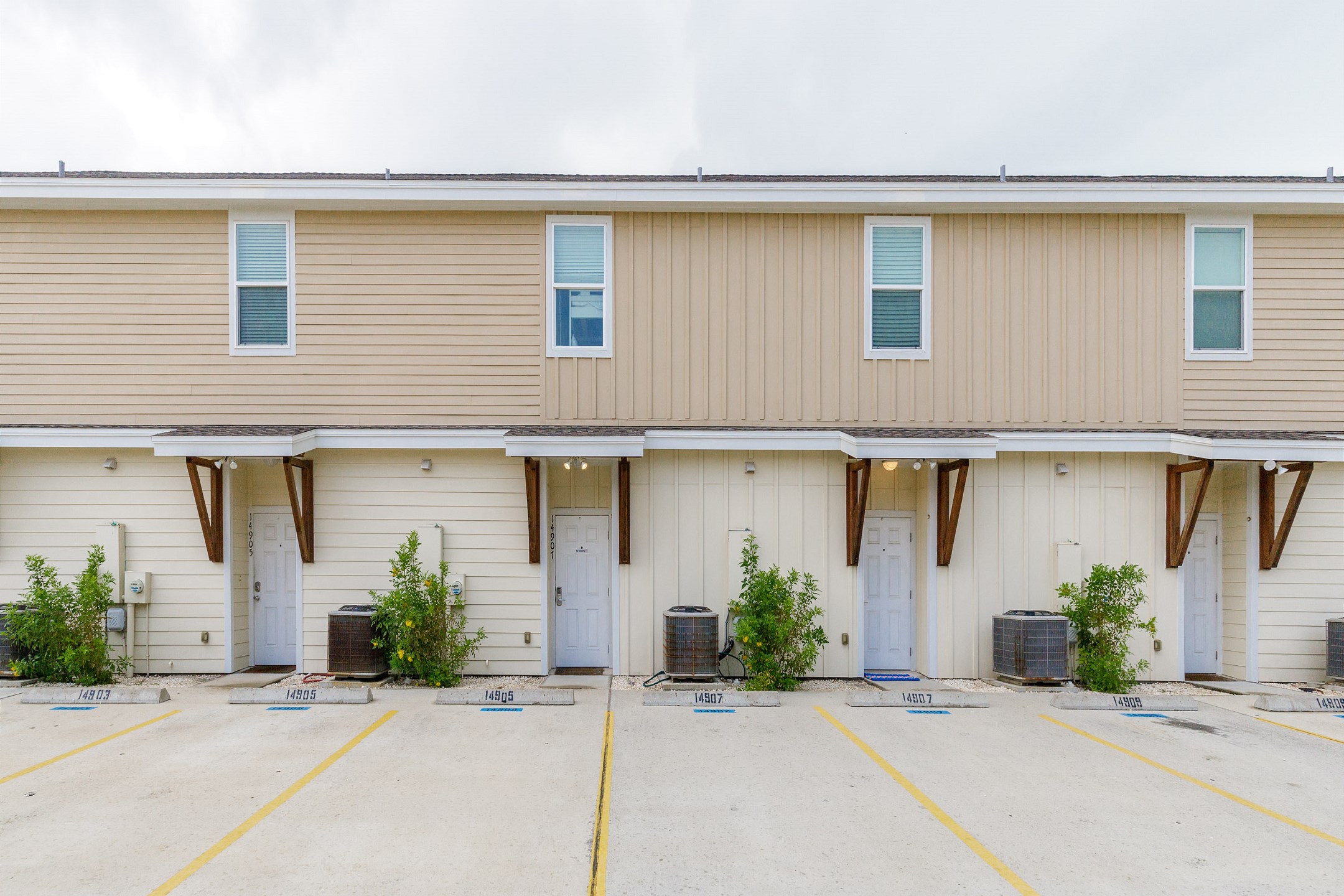 Entryway and two reserved parking spaces