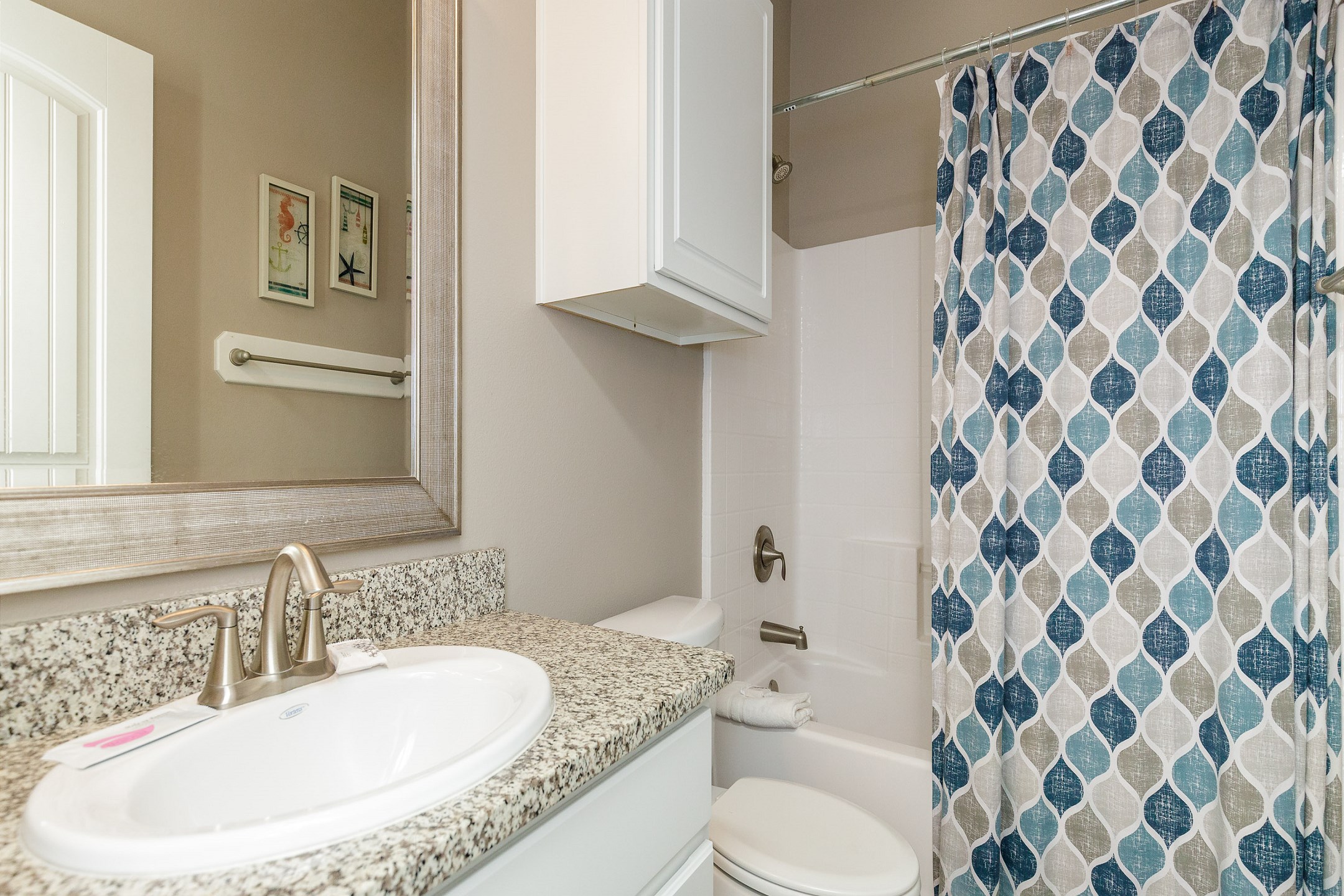 Guest bathroom on the second floor with tub and shower combo