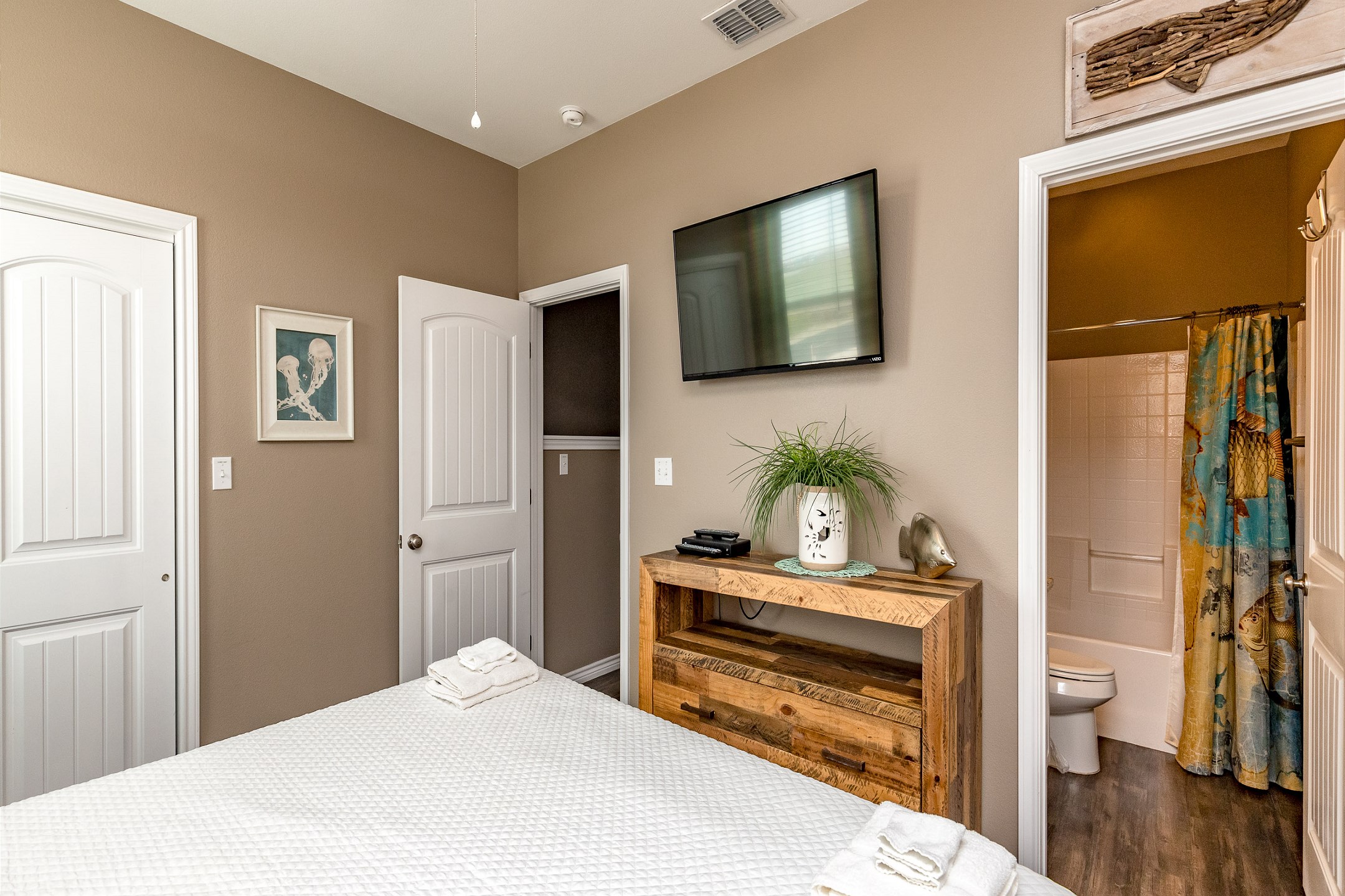 Serene master bedroom on the second floor featuring a luxurious king-size bed and an en-suite bathroom for ultimate privacy and relaxation.
