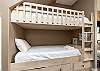 Twin bunk beds on the first floor by common area