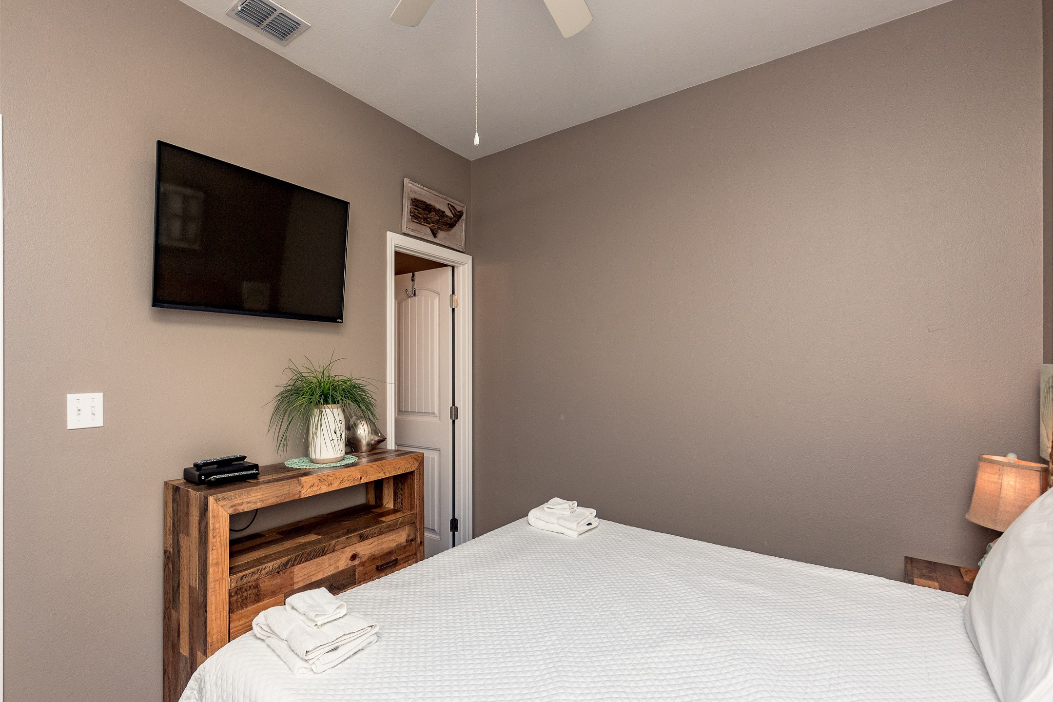Master bedroom on the second floor with king size bed, and private bathroom