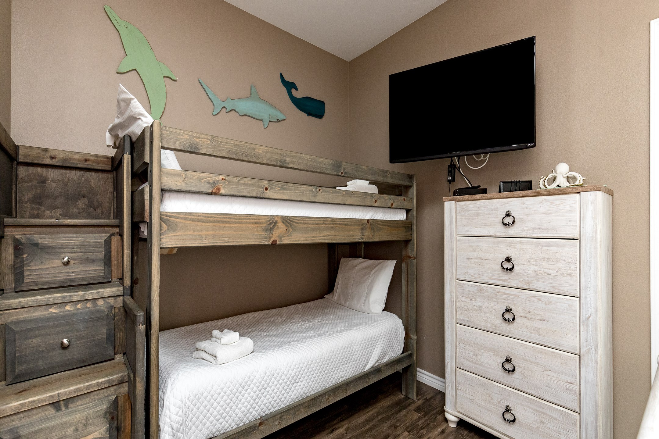 Second bedroom on the second floor with queen size bed and two twin size bunk beds