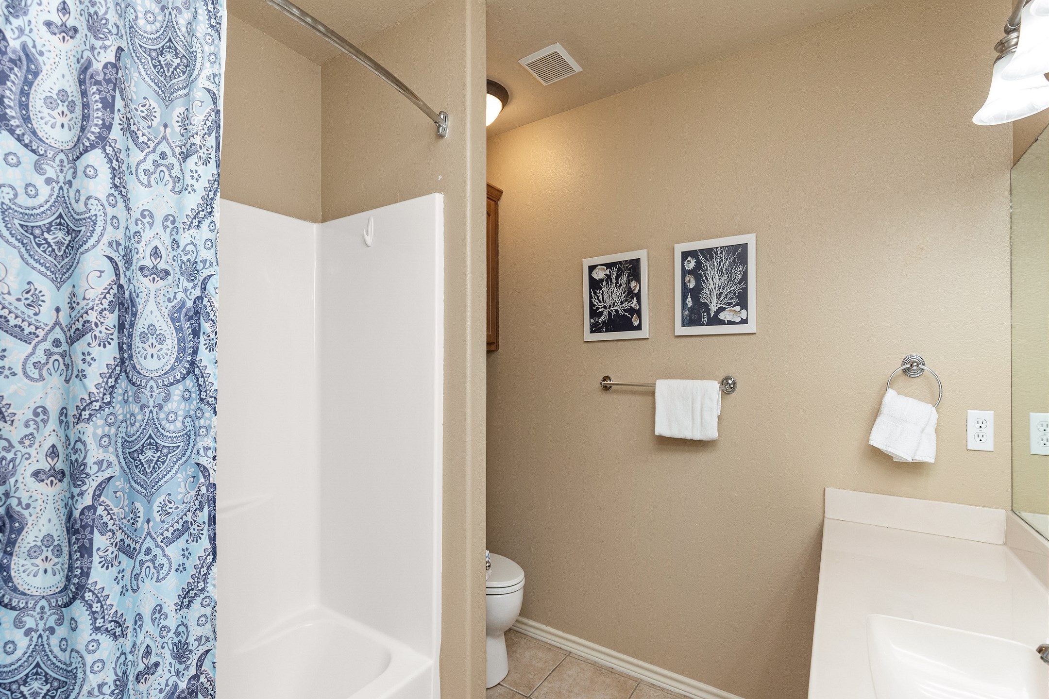 Guest bathroom on the second floor with tub and shower combo