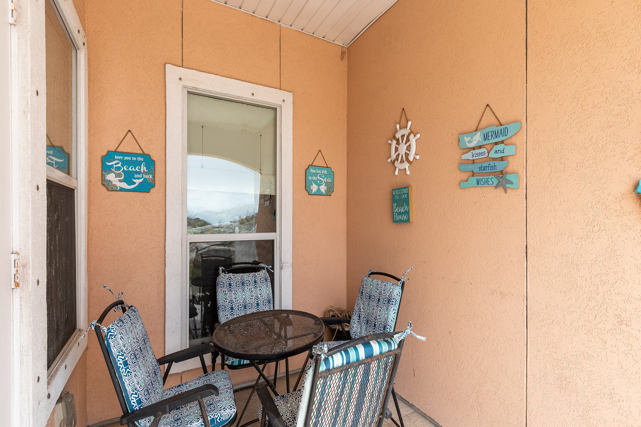 Private patio area with table and chairs 