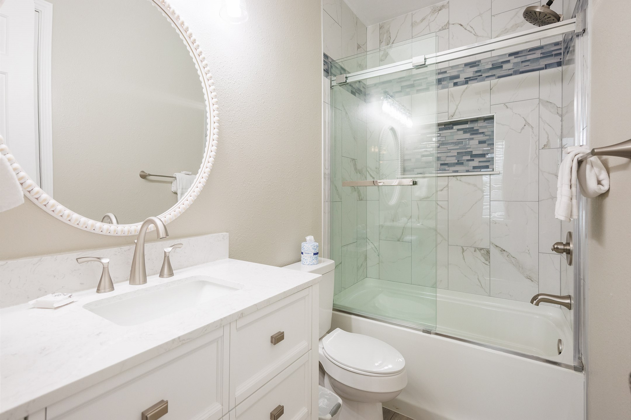Guest bathroom with sink and tub/shower combo 