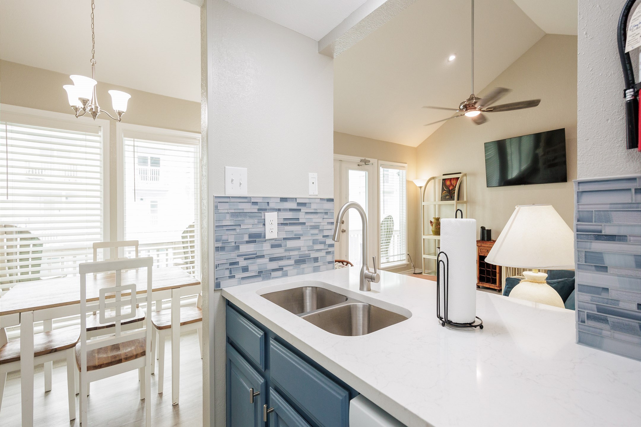 Open concept kitchen looks over the dining and living area 