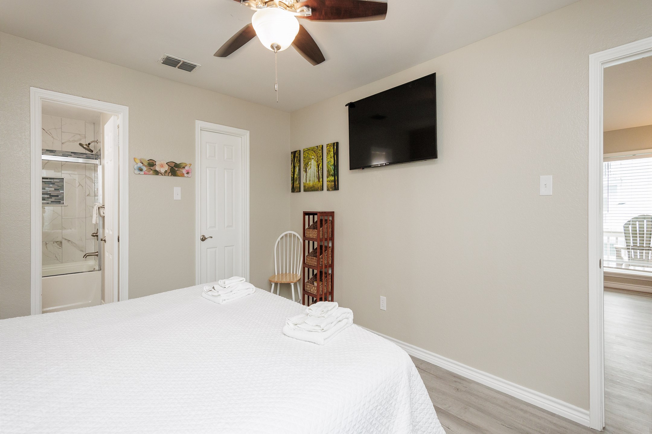 Master bedroom with king size bed, ensuite bathroom and flat screen TV 