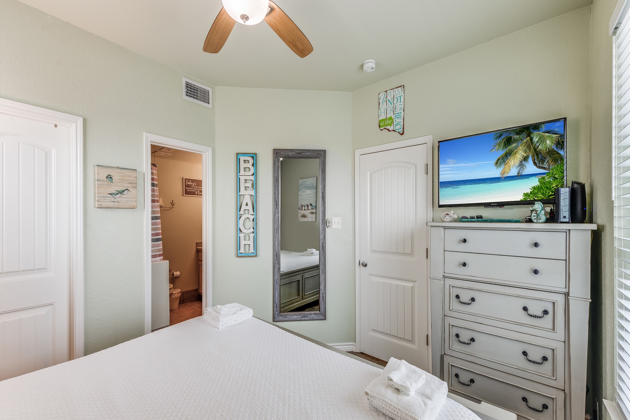 Master bedroom with king size bed, ensuite bathroom and flat screen TV