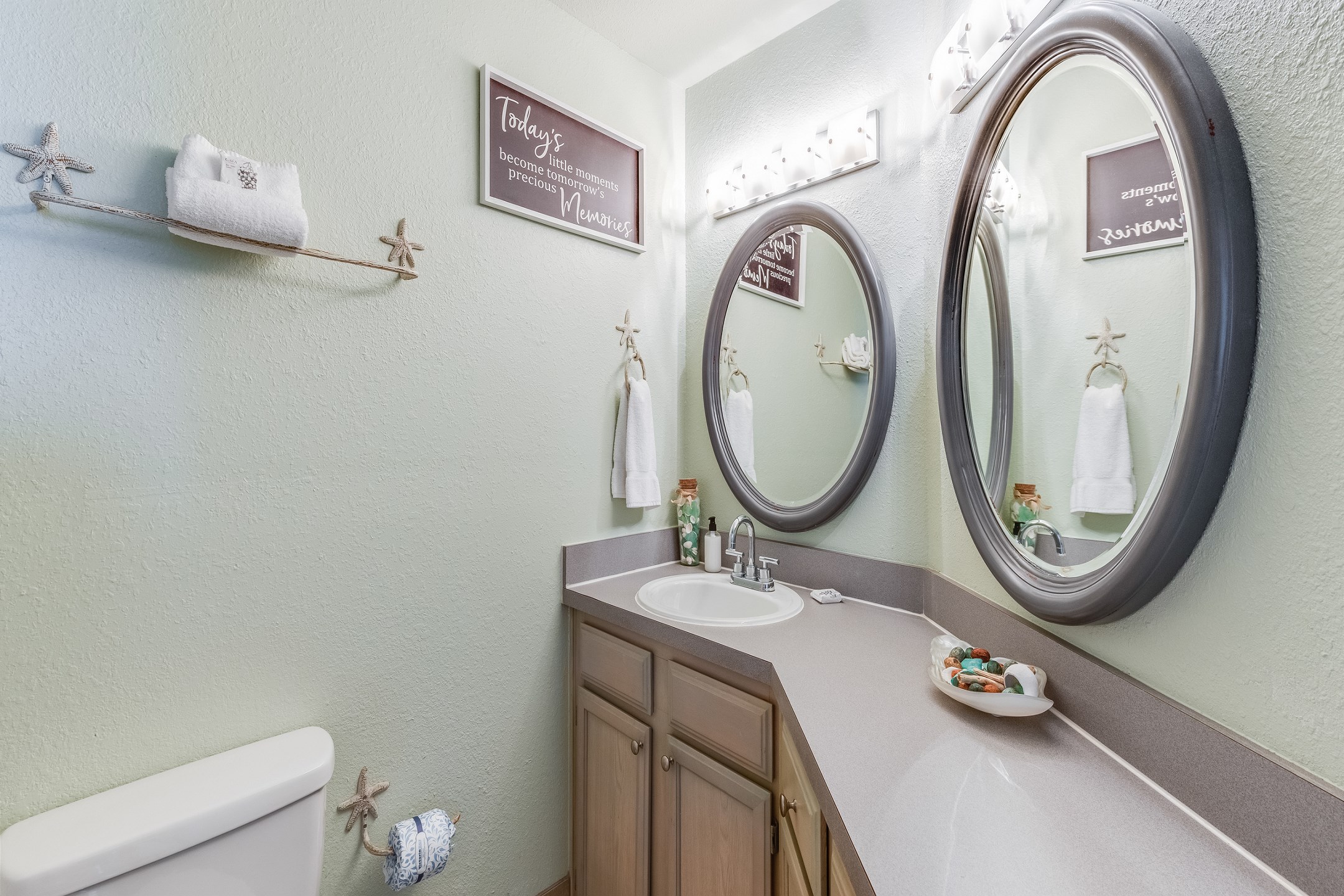 Guest bathroom with ample storage space, and tub/shower combo