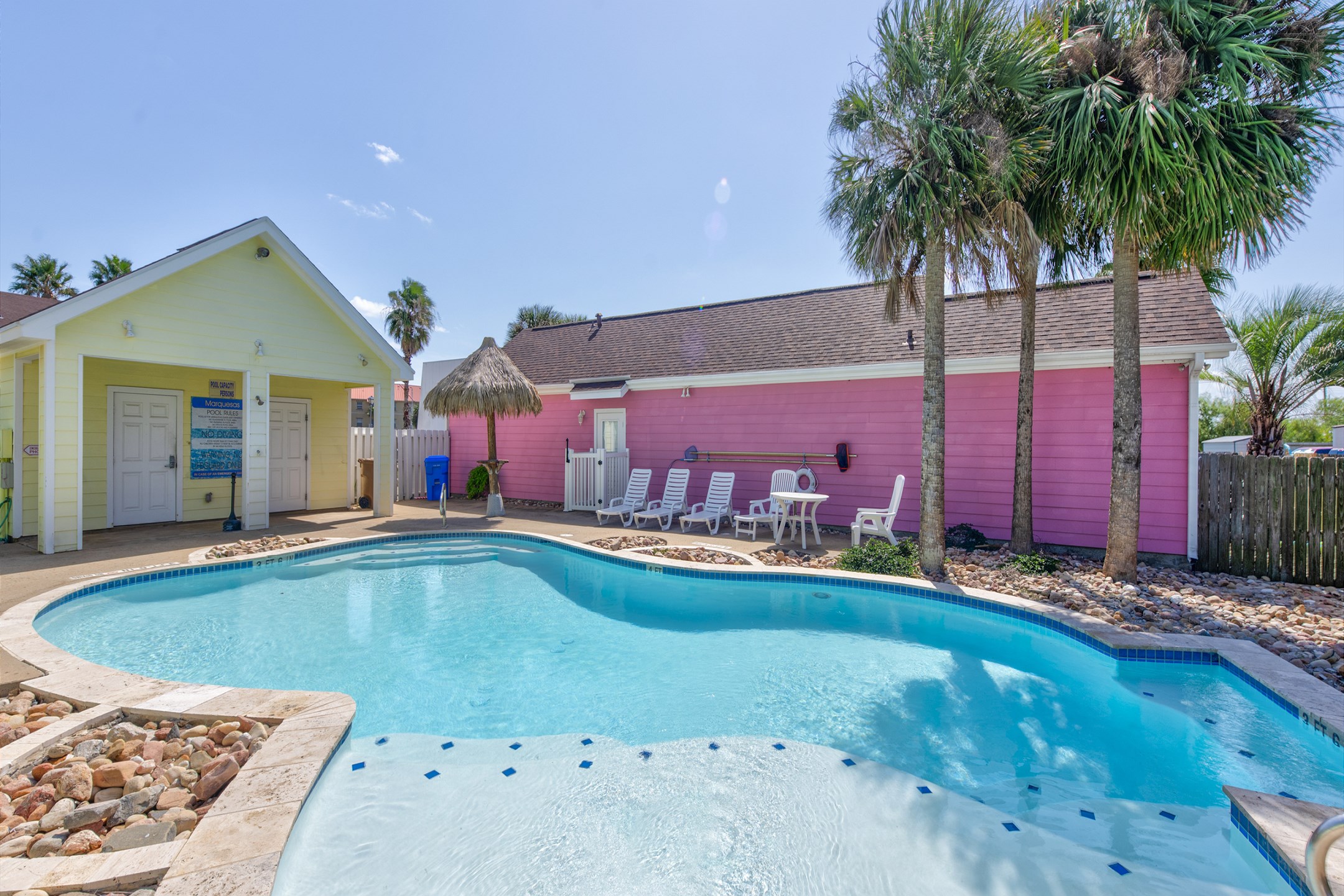 Admire the shimmering pool and experience paradise, surrounded with beautiful scenery