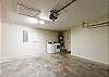 Large garage with parking for two, along with access to the washer and dryer