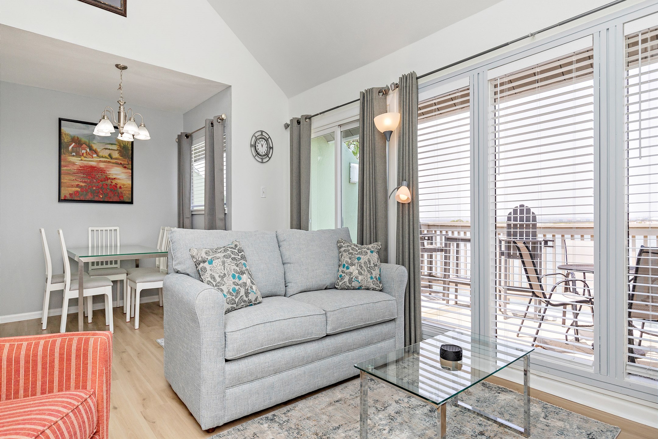 Remodeled interior with new laminate flooring throughout and blinds that offer the natural light to shine in through the large windows 