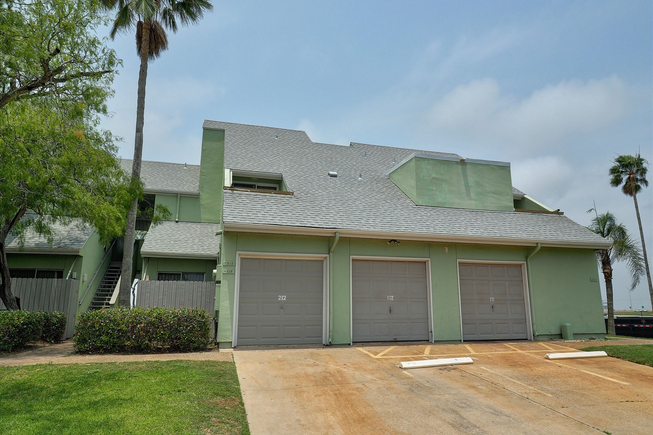 Welcome to Puente Vista #212 with parking in front of garage