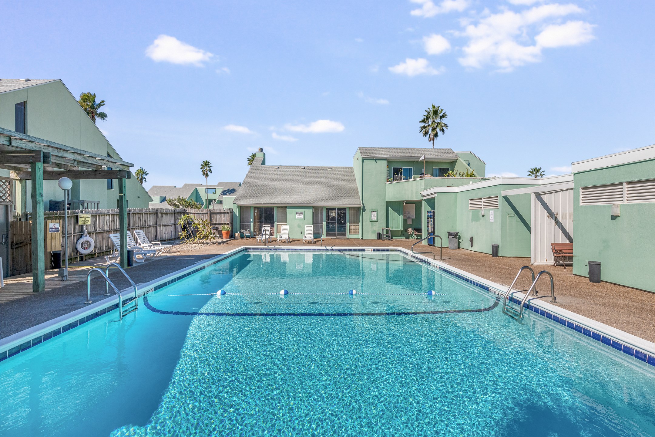 Dive into island vibes at this shimmering pool, surrounded with relaxing lounge chairs