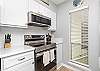 Fully equipped kitchen with updated appliances and ample storage space