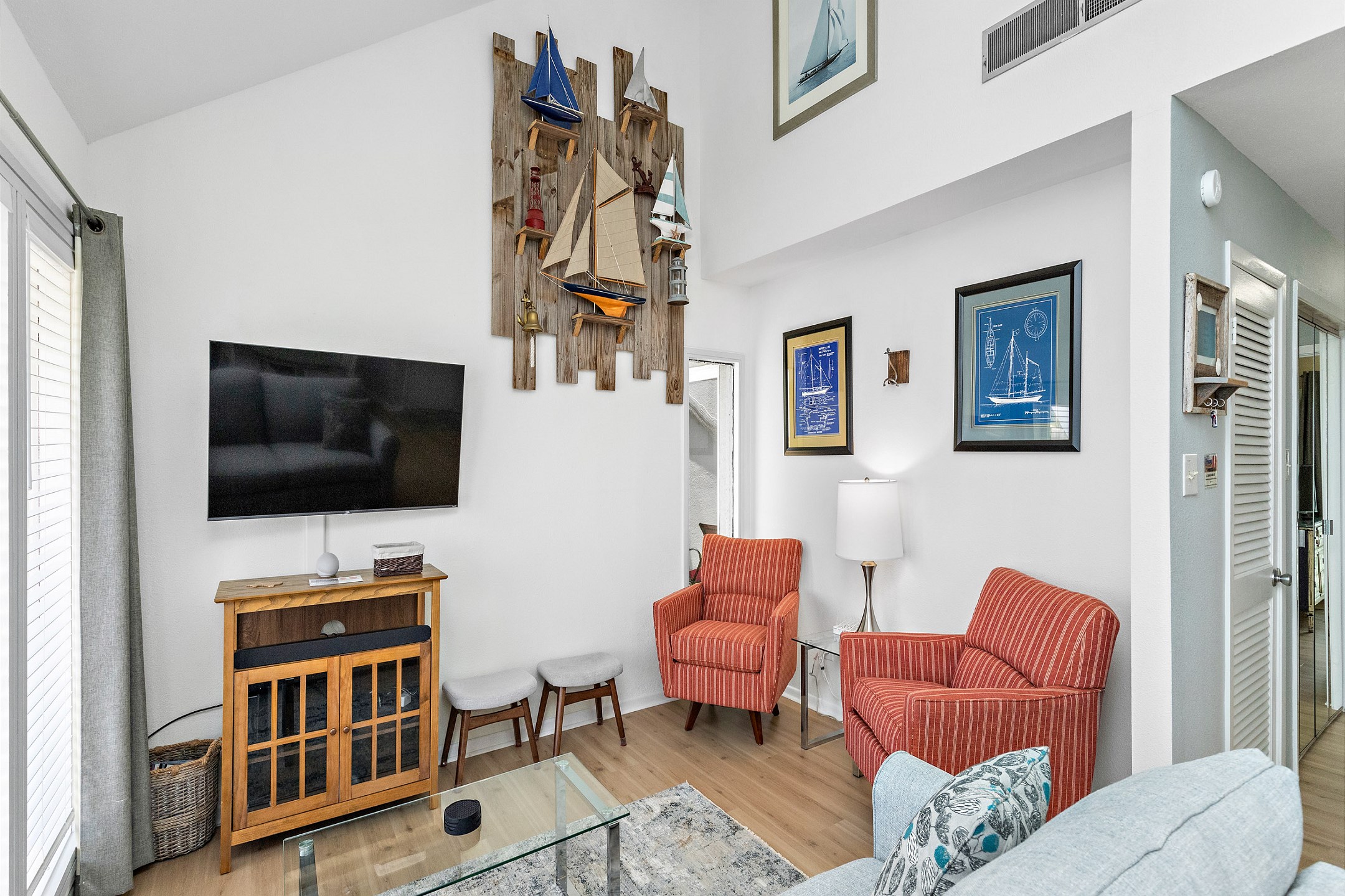 Coastal features throughout the living space with Lazy Boy queen size sleeper sofa and 4K HDR Smart TV to enjoy 