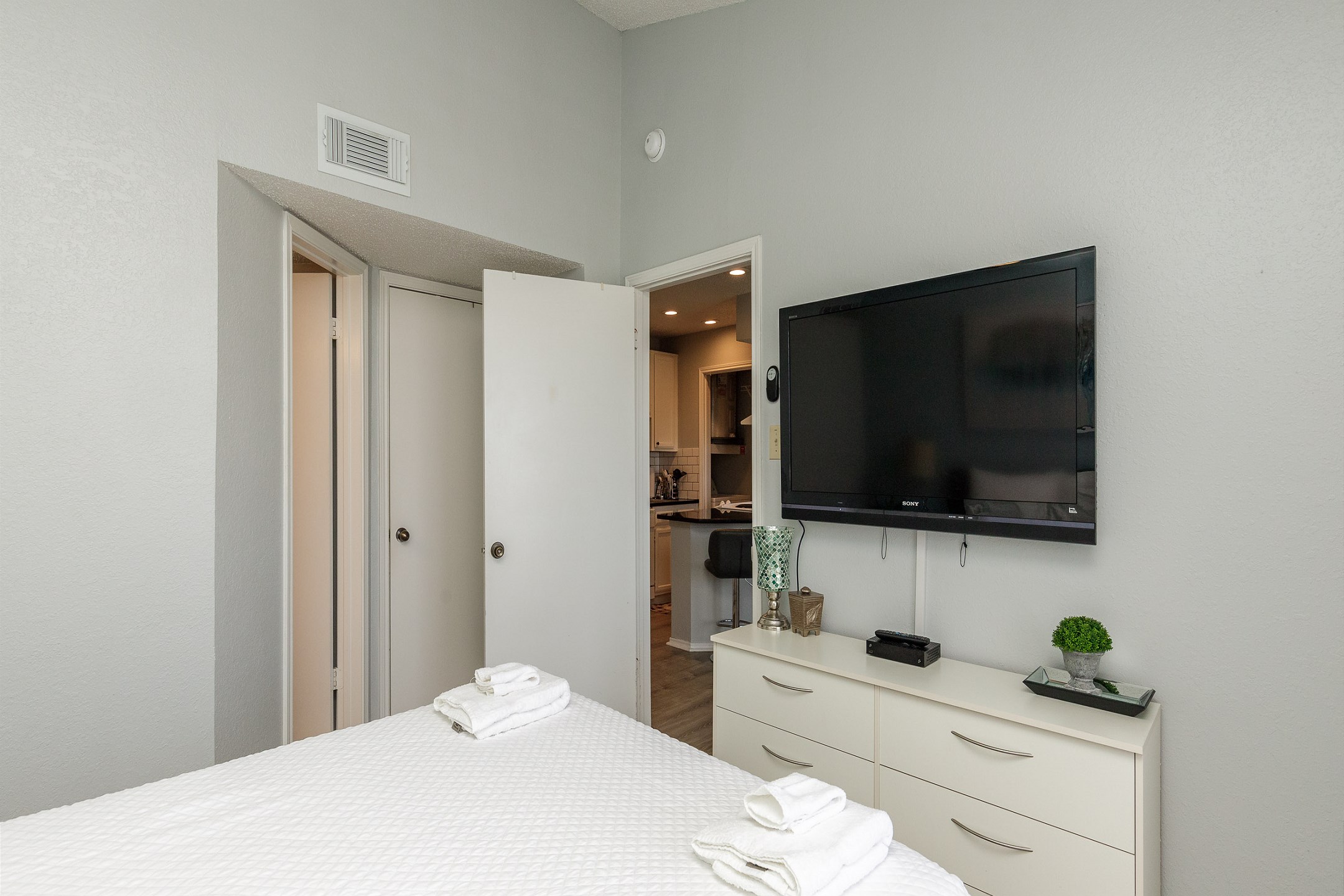 Master bedroom with queen size bed and flat screen TV