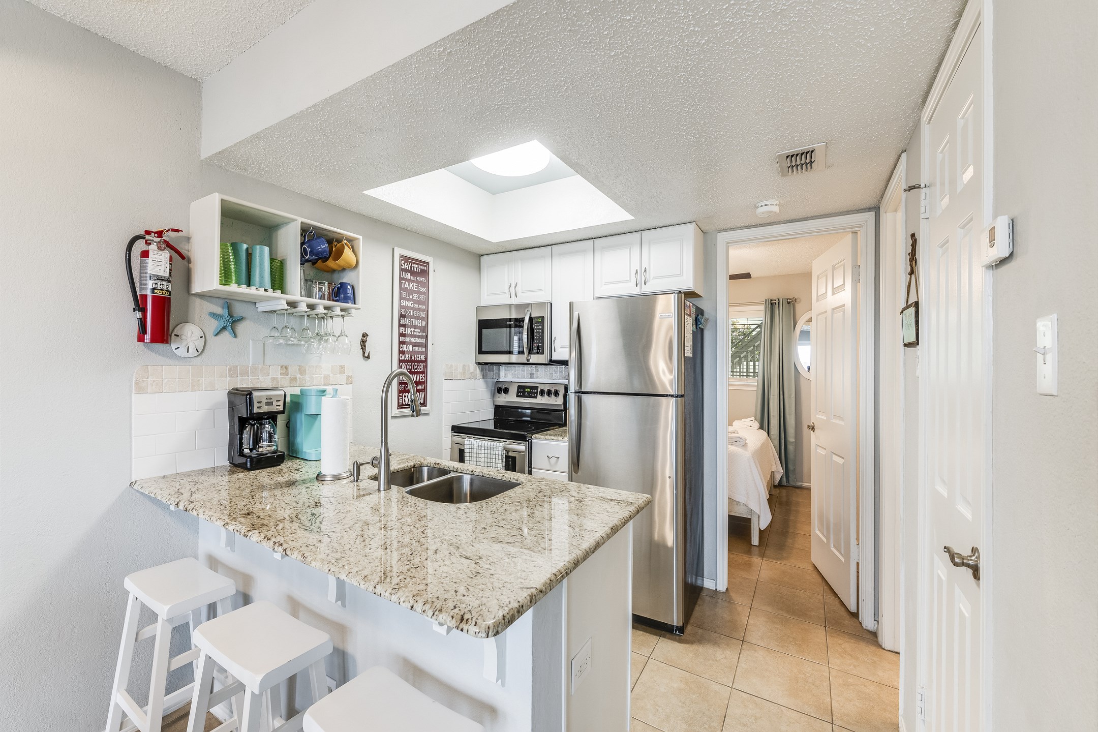 Whip up your favorite meals in the modern, fully equipped kitchen with sleek stainless steel appliances—perfect for cooking up a vacation feast or quick snacks between adventures.
