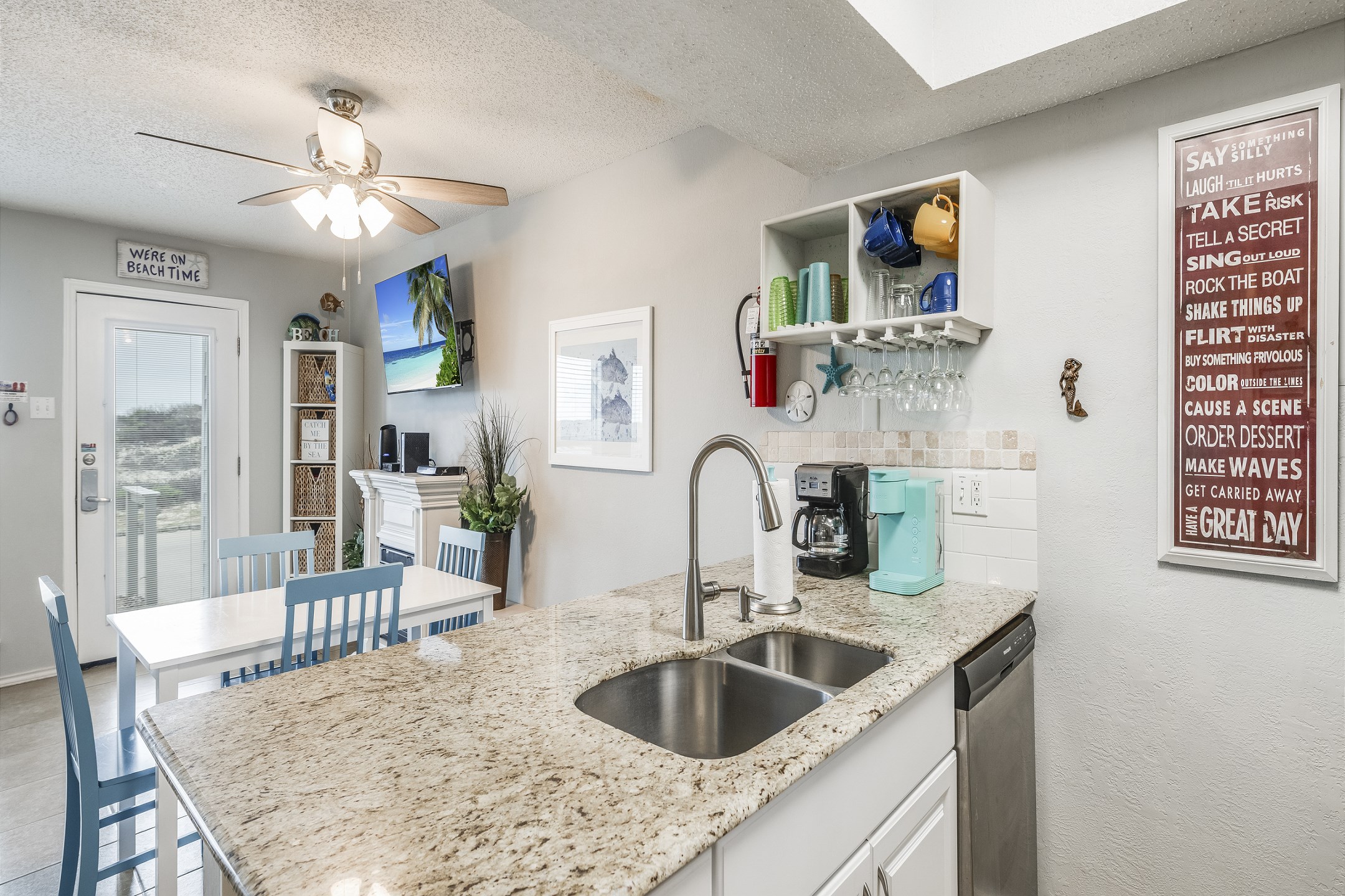 Enjoy a beautiful kitchen area complete with a 12-cup coffee maker and Keurig—perfect for brewing your morning coffee and enjoying the relaxed vacation vibes.