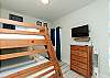 Second bedroom with twin over full size bunk bed along with flat screen TV