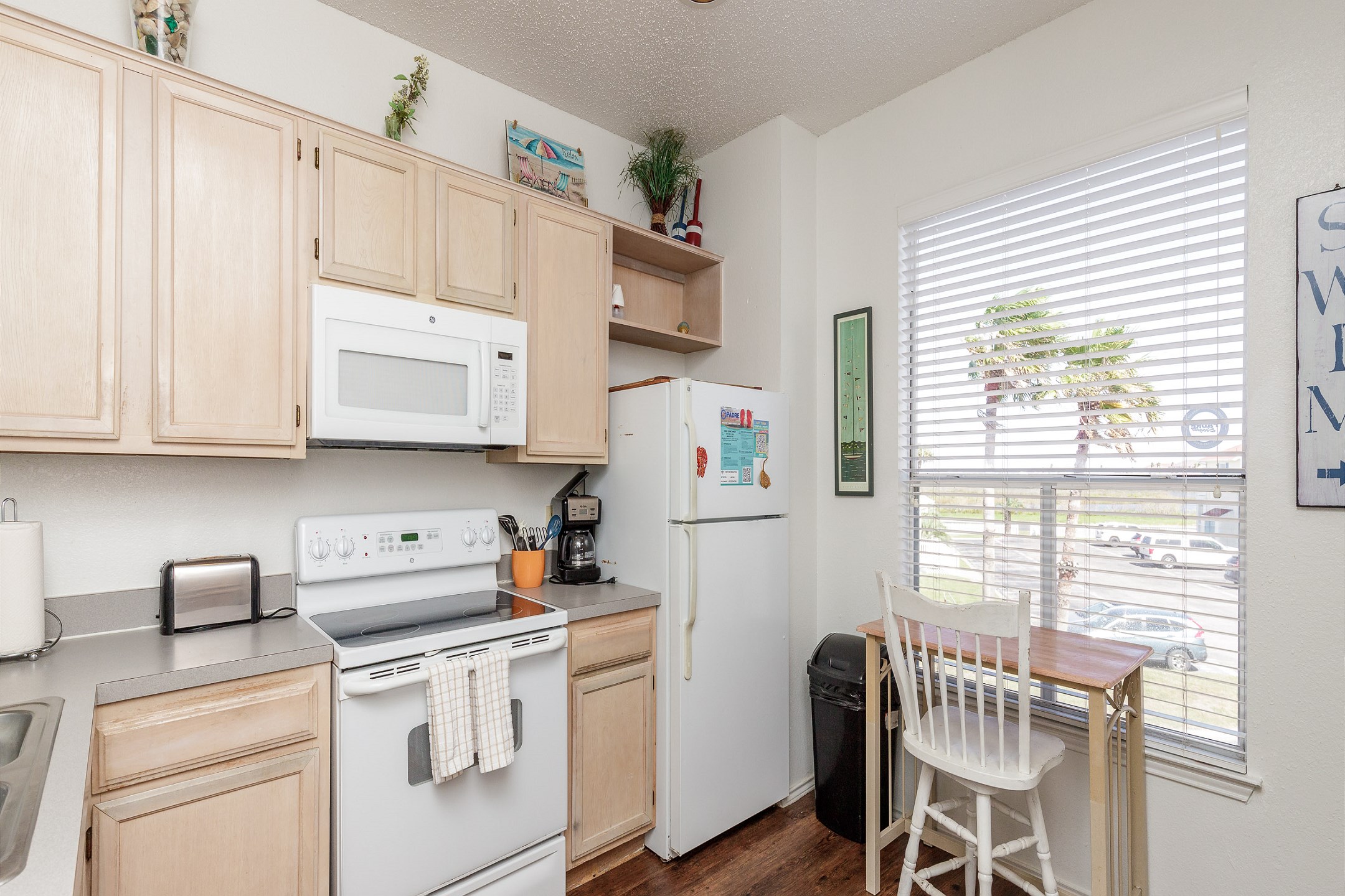 Open kitchen area with 12 cup coffee maker 