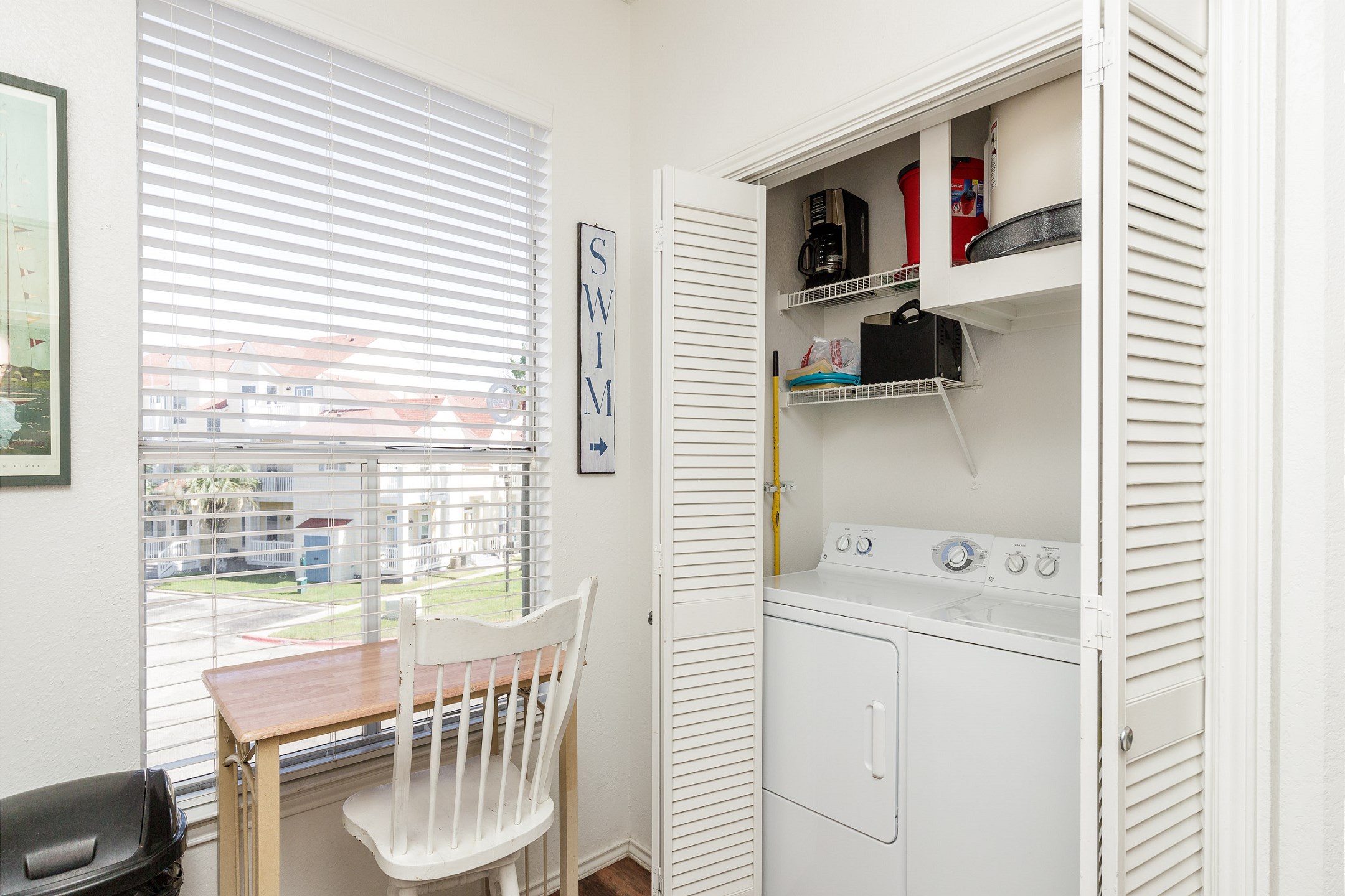 Kitchen area with a small workspace, plus the convenience of an in-unit washer and dryer