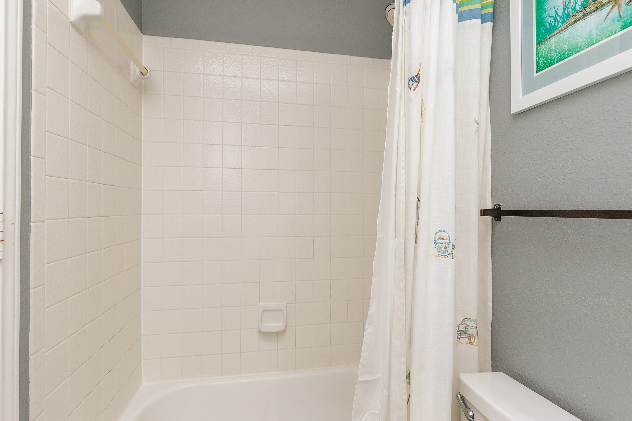 Attached, guest bathroom with tub and shower 