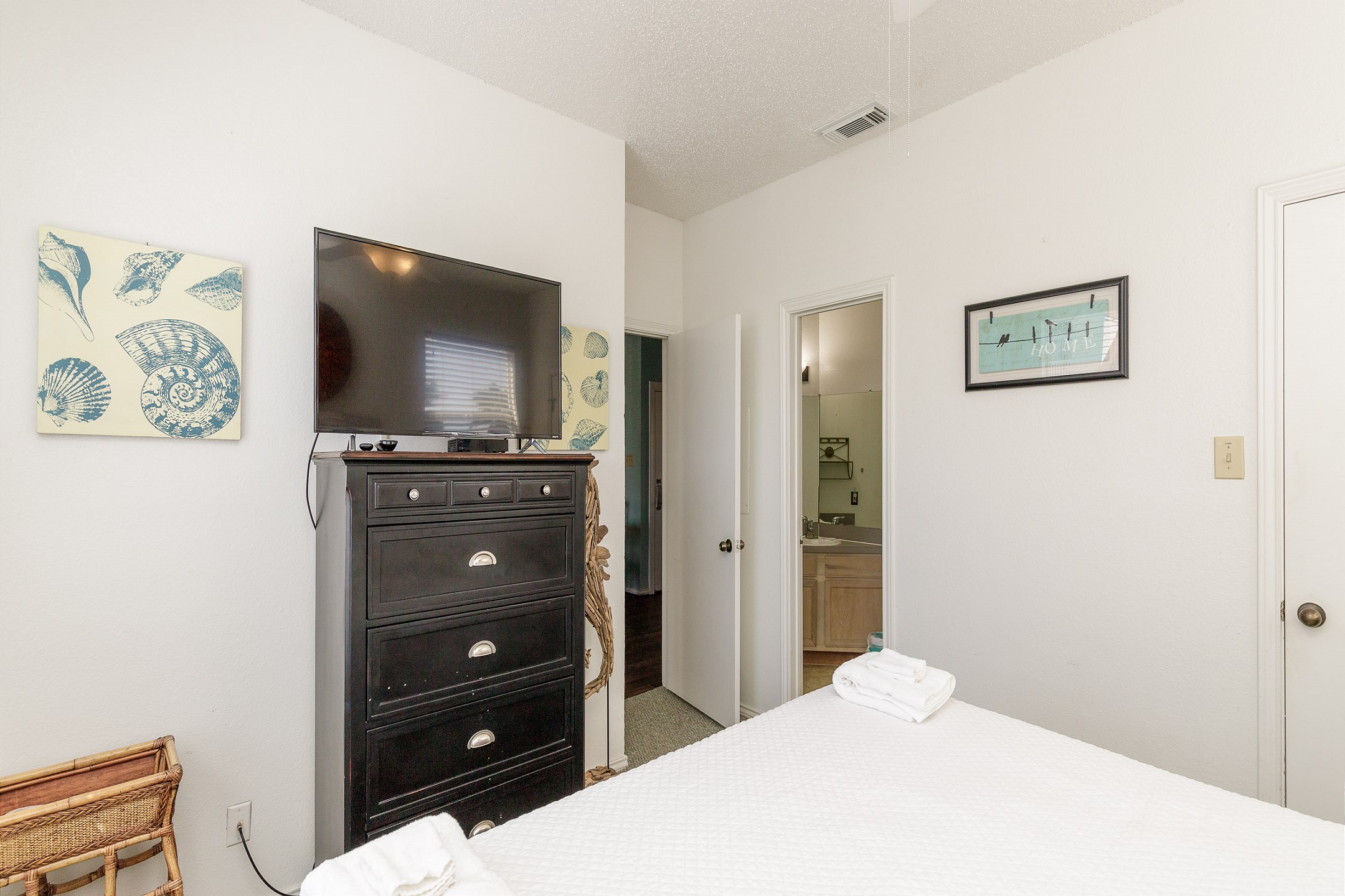 Master bedroom with king size bed and flat screen TV