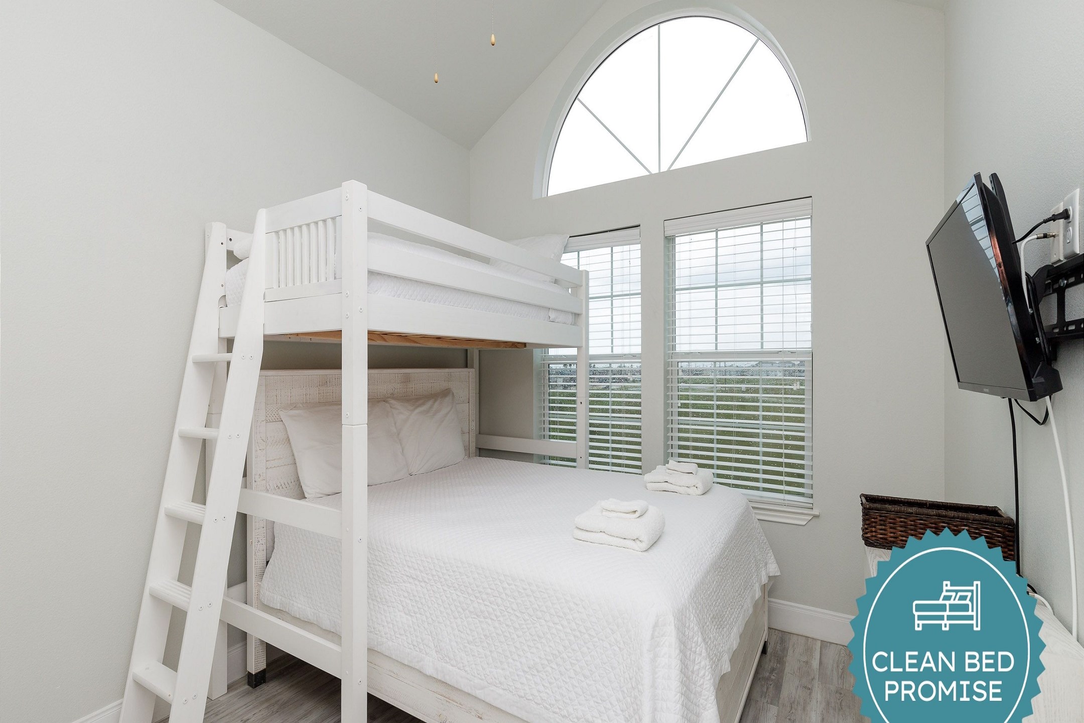 Fourth bedroom on third floor with twin bunk bed over queen size bed