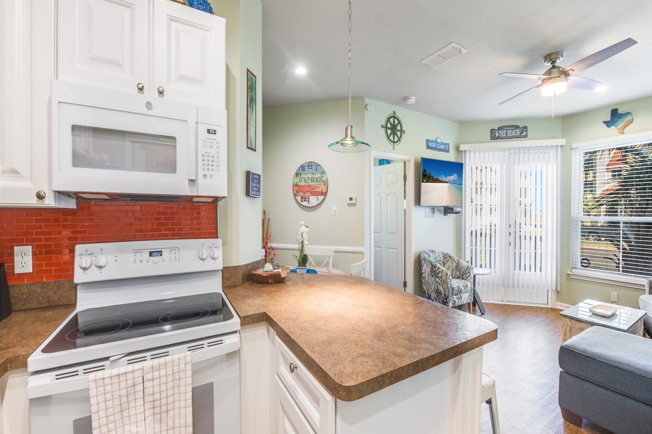 Open concept layout connecting the living and dining area to the kitchen