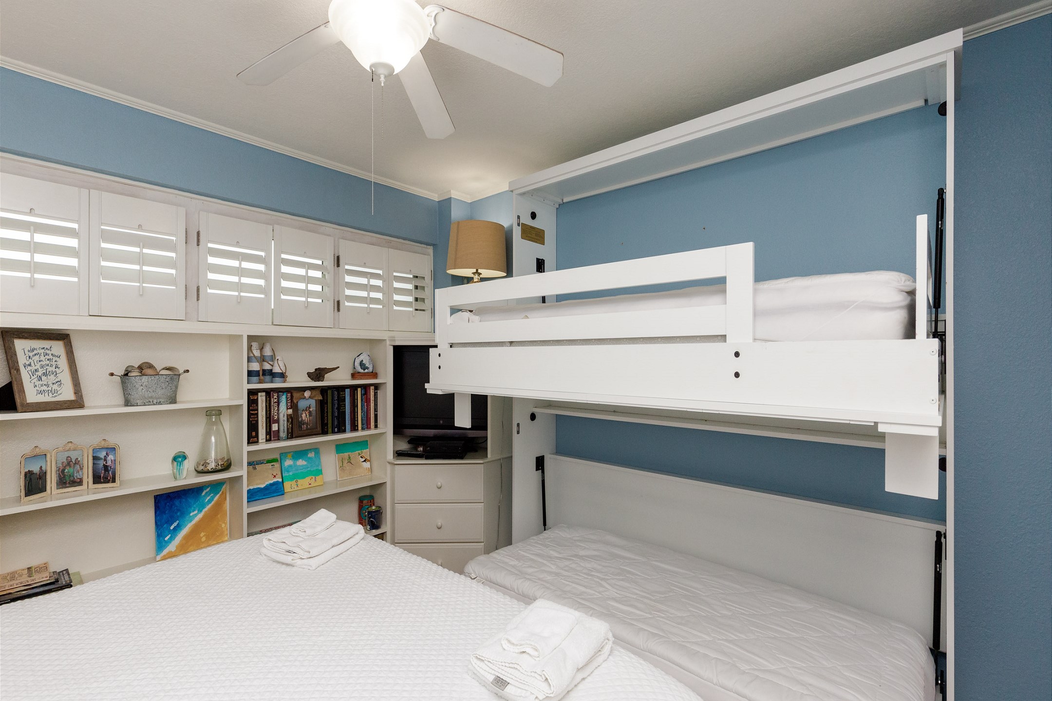 Second bedroom with king size bed and credenza with two twin size beds