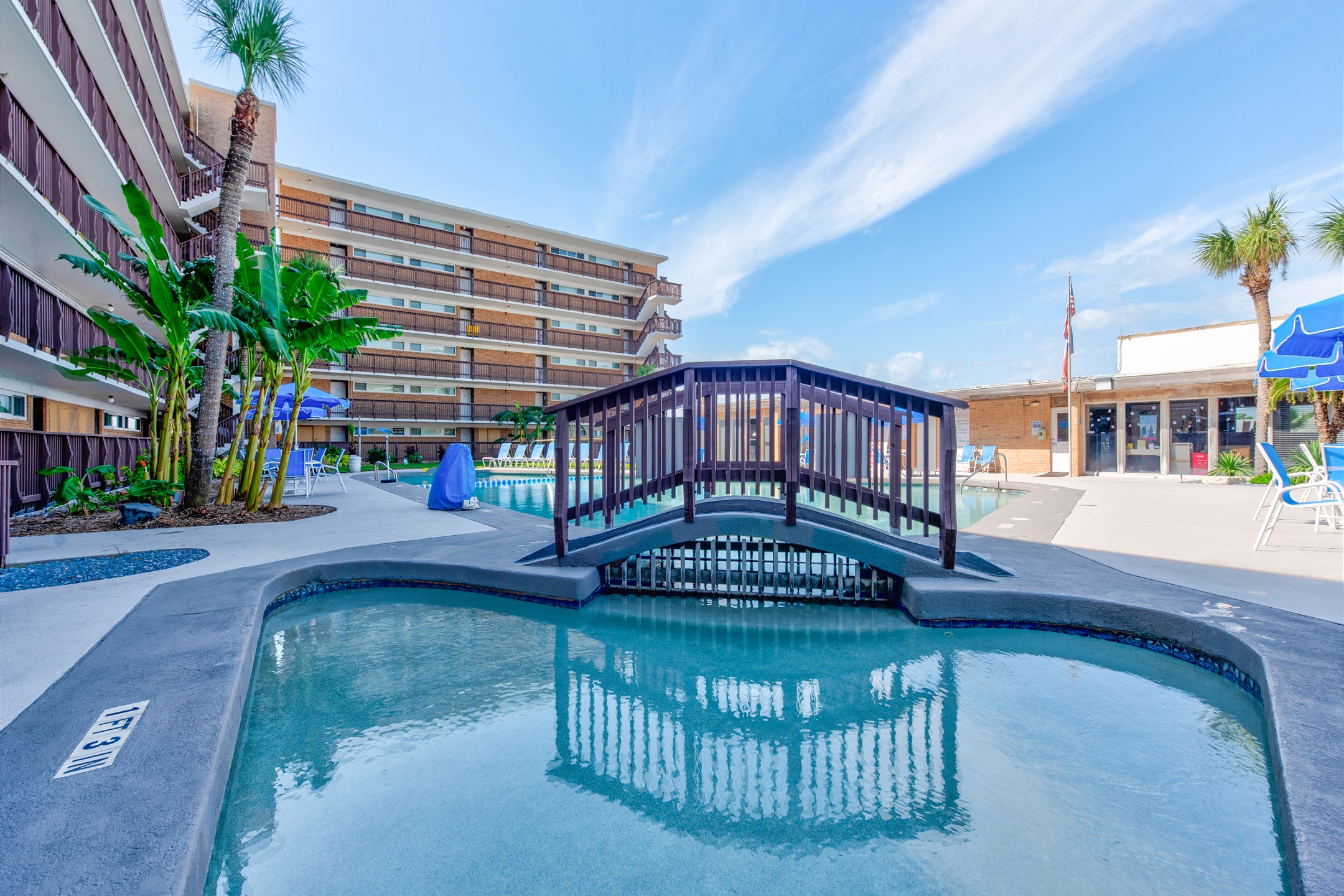 Unwind in style and enjoy the walkway through the pool area at Gulfstream