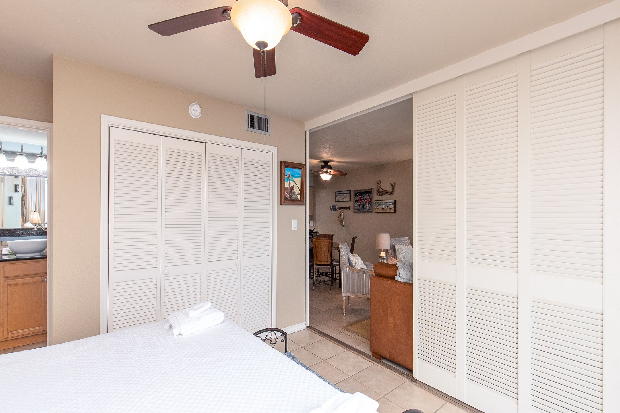 Master bedroom with king size bed, private bathroom and shutters that open up