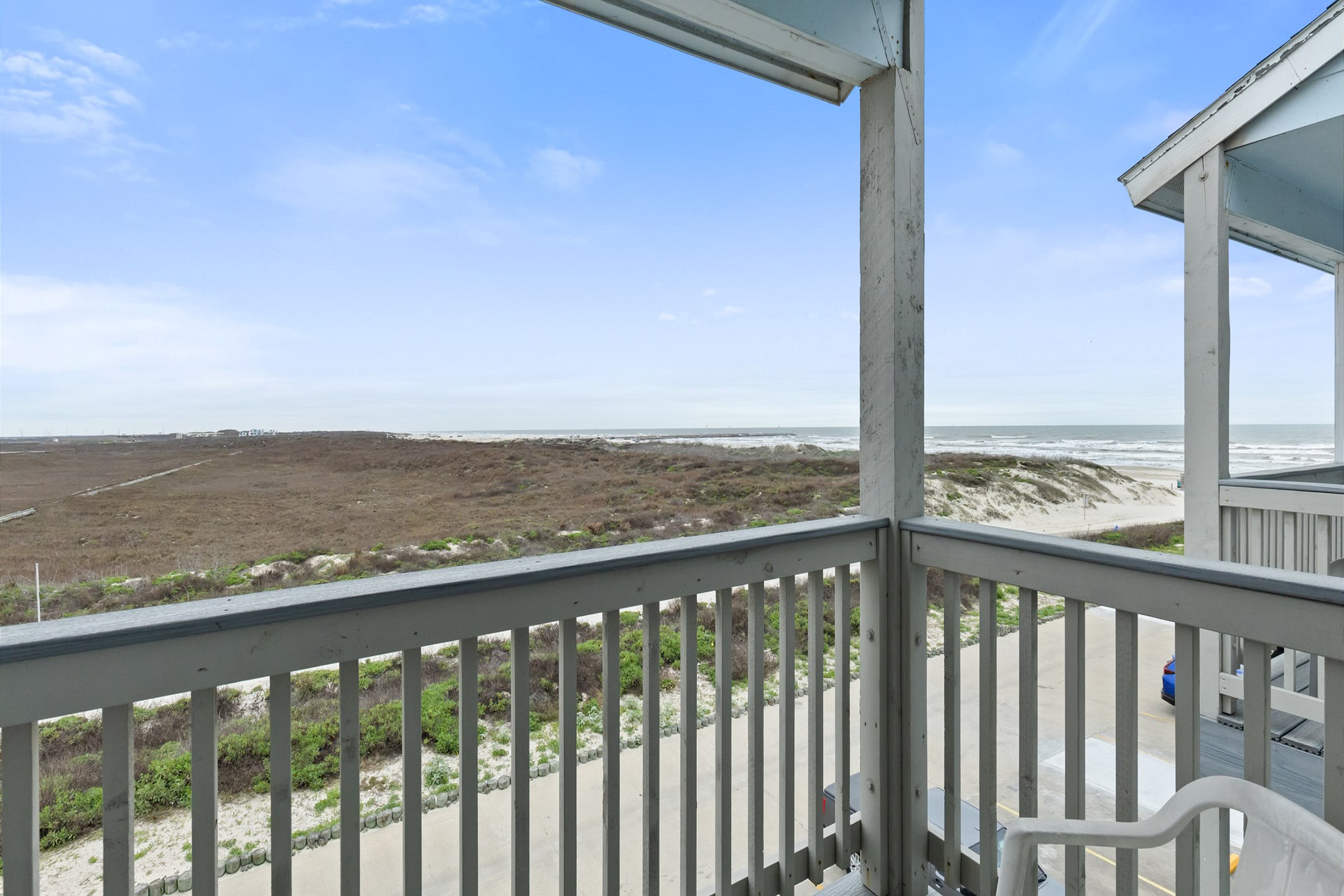 Private balcony off the master bedroom with a view of the coastal dunes, the beach, and Gulf of Mexico