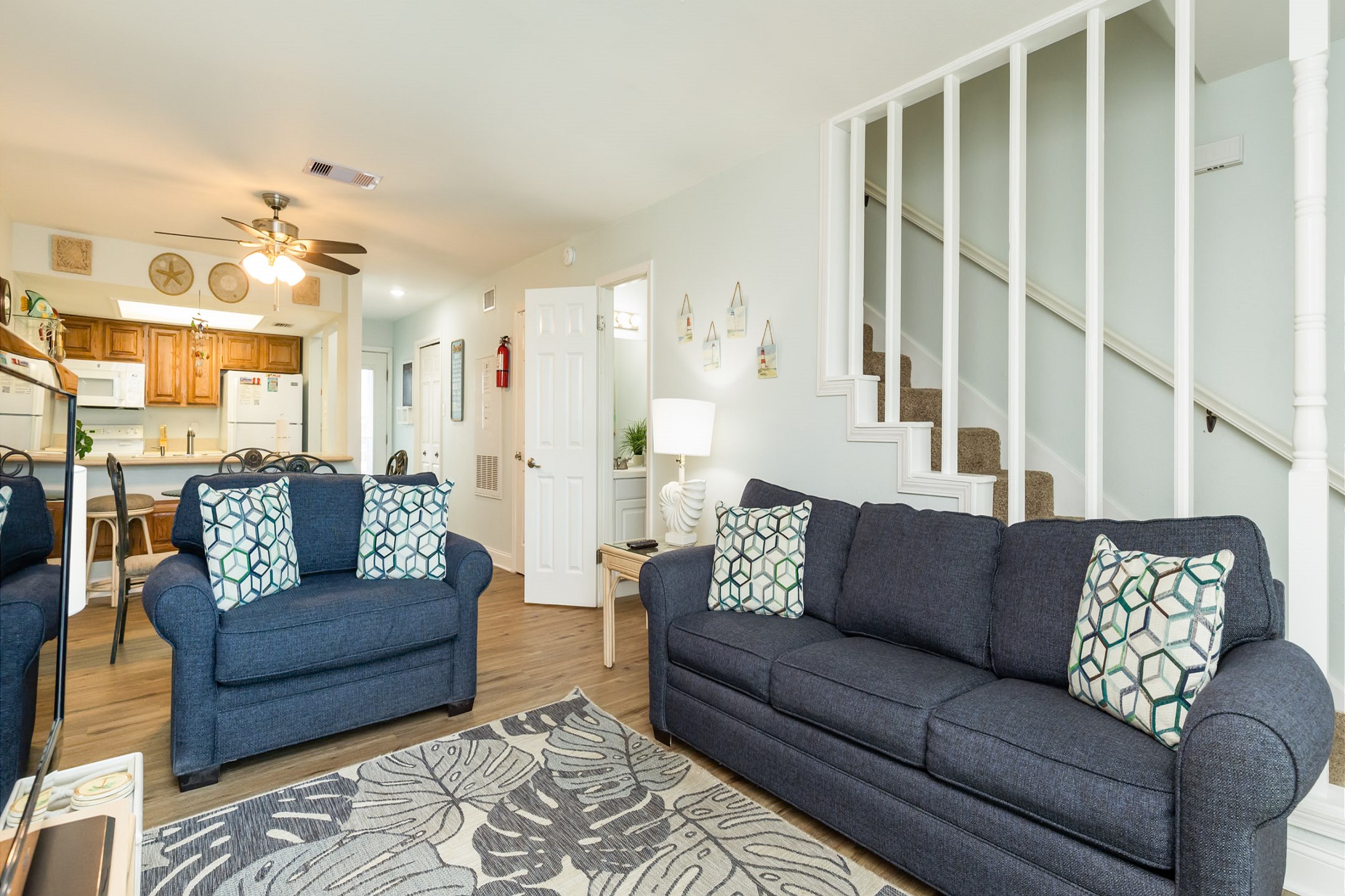 Spacious and sunny living area designed for family enjoyment, with plenty of seating available