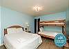 Second bedroom with queen size bed and a twin-over-full size bunk bed