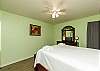 Master bedroom with queen size bed and flat screen TV