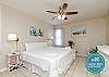 Master bedroom with king size bed and flat screen TV