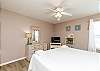 Master bedroom with king size bed and flat screen TV