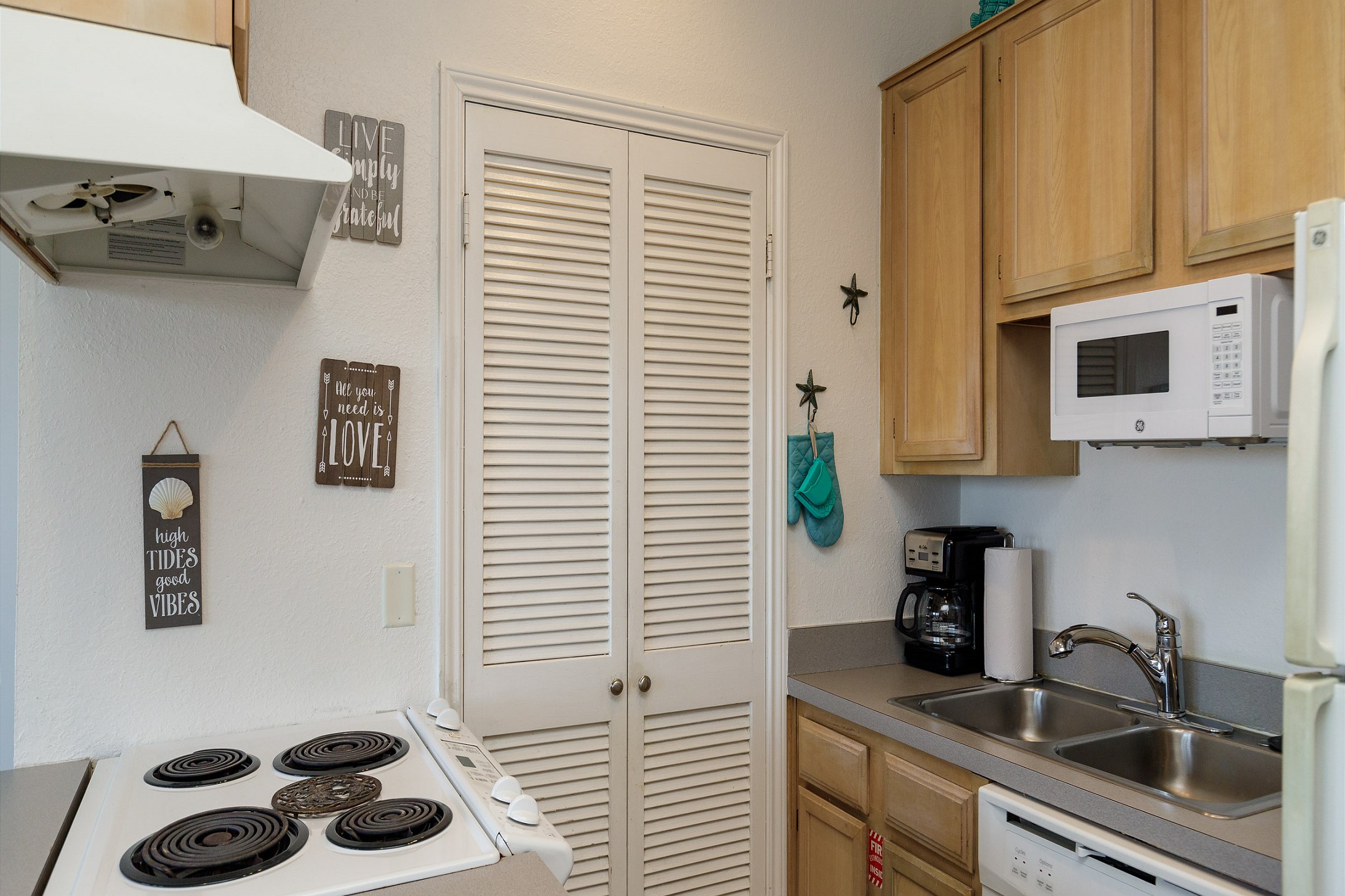 Kitchen with 12 cup coffee maker and all the cookware you need to prepare all your meals