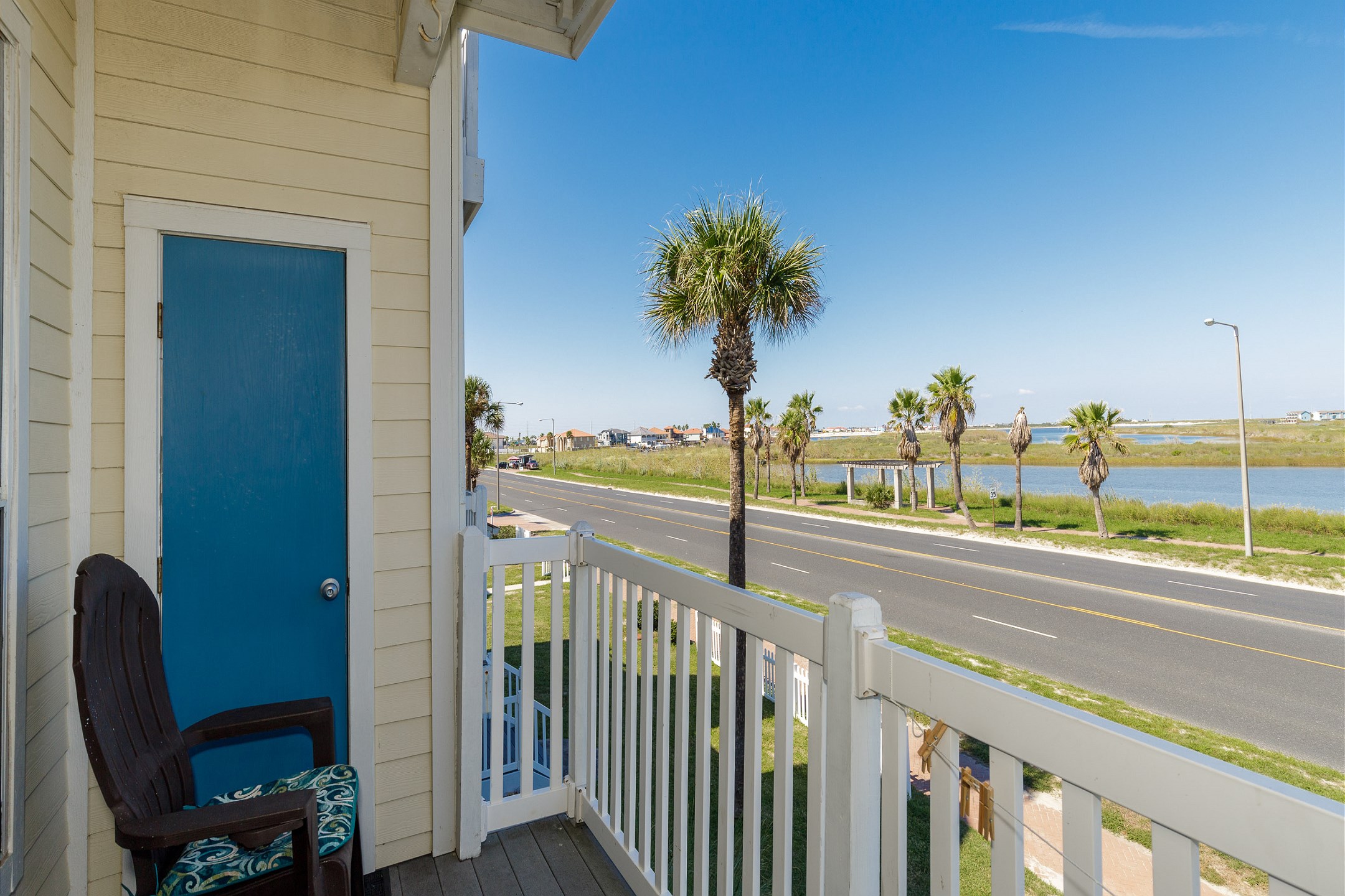 Relax on your private balcony, the perfect spot to watch beachgoers make their way to Whitecap Beach