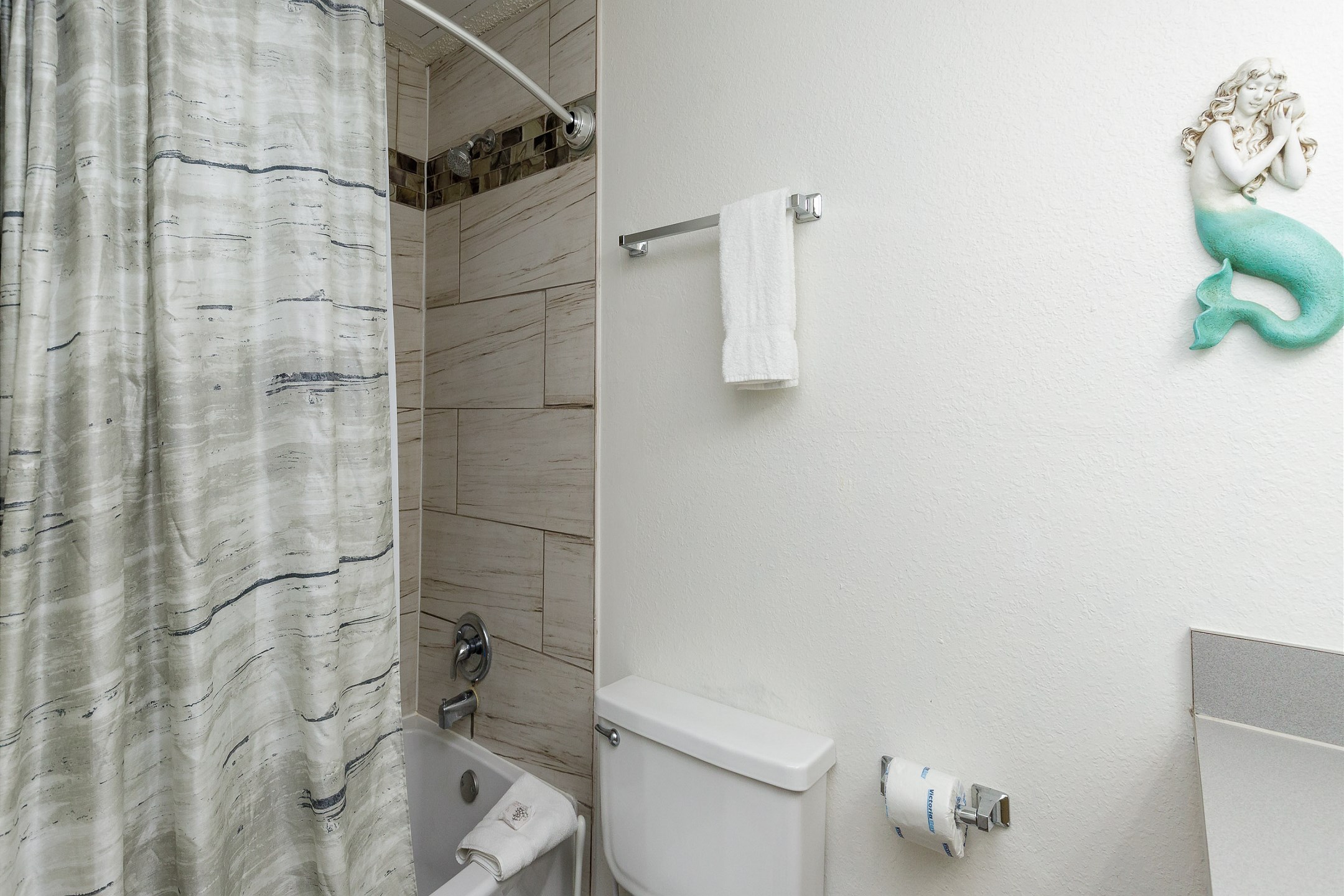 Bathroom with tub and shower 