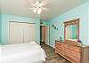 Second bedroom with queen and twin size beds, along with flat screen TV