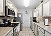 Fully equipped kitchen with stainless steel appliances and Keurig coffee maker 