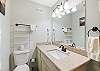 Full bathroom with plenty of counter space and walk in shower 