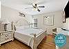Master bedroom with king size bed and flat screen TV
