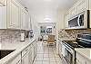 Fully equipped kitchen with stainless steel appliances and plenty of counter space